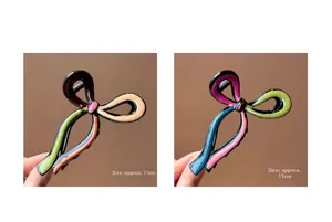 Detail of 11cm colorful resin hair claw clips with glossy finish and bow shape design