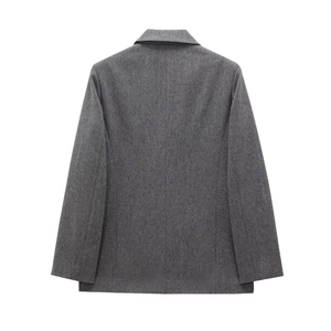 Back view of grey herringbone wool blend blazer jacket for women in minimalist style