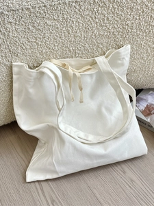Minimalist off-white large capacity canvas tote bag with comfortable shoulder straps