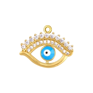Macro shot of gold-plated copper evil eye pendant with blue enamel and clear zircon stones