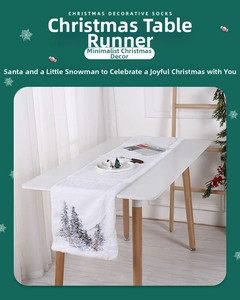 Close-up of white plush Christmas table runner with embroidered winter pine tree details