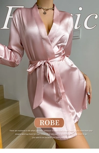 Pink satin robe for women with deep V-neck and waist tie on a stylish model