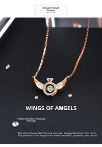 Detail of rose gold angel wing necklace with a dancing cubic zirconia stone