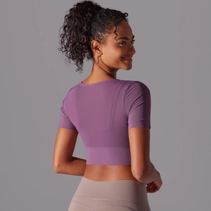 Rear view of tight purple mesh stitching yoga top with slim fit and cropped design