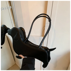 Detailed view of creative black dachshund-shaped leather shoulder bag with silver zipper