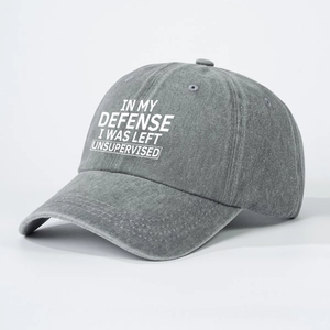 Grey washed denim baseball cap with IN MY DEFENSE I WAS LEFT UNSUPERVISED print