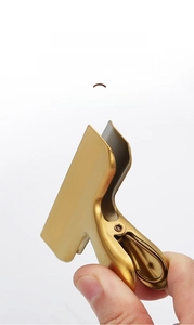 Close-up of golden stainless steel sealing clip showing strong grip and secure seal