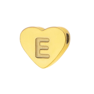 Detailed view of heart-shaped gold-plated bead with engraved letter E for DIY jewelry