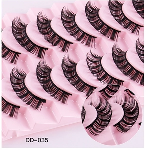 Detail view of DD-035 synthetic false eyelashes showing dense curl and fine hair texture