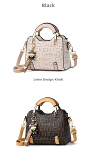 Detail view of khaki and black monogram handbags with gold handles and bull charms