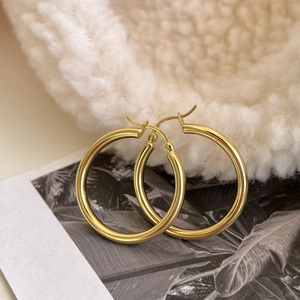 Classic golden thick hoop earrings made of 925 sterling silver with a polished finish