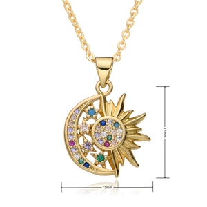 Macro shot of 17mm gold sun and moon pendant with colorful zircon stones on white background