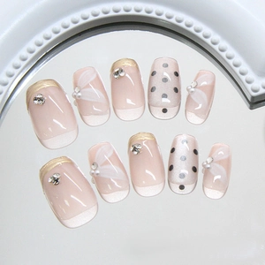 Champagne french cat-eye press-on nails with pearl, rhinestone and polka dot details