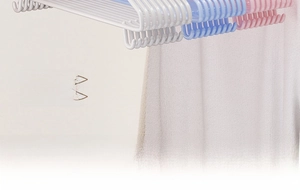 Detail of plastic non-slip hangers with functional small hooks in white blue and pink