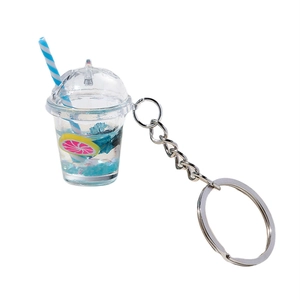 Luminous fruit milk tea cup keychain with blue liquid, lemon slices, and striped straw