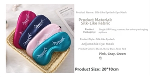 Detailed view of adjustable faux silk sleep masks with eyelash prints in home setting