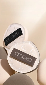 Detailed view of high-quality Rubycell and PU leather makeup puffs with ribbon handles