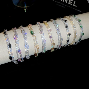 Close-up of double-layer 18k gold plated bracelets with sparkling zircon stones
