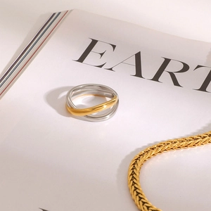 Polished two-tone 18K gold and silver stainless steel intertwined geometric ring