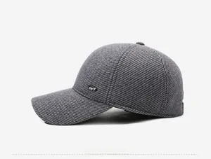 Close-up of grey wool texture on men winter baseball cap with SPORT side patch