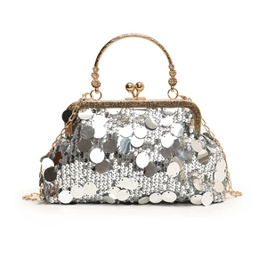 Elegant silver sequin evening shell bag with gold handle and chain shoulder strap