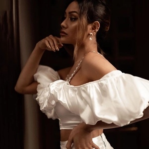 Elegant white off-shoulder puff sleeve crop top and bodycon mini skirt two-piece set