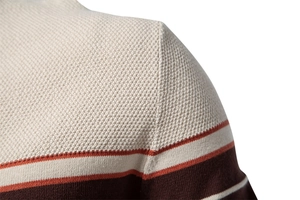 Macro detail of the fine knit texture and color-blocked stripes on a men's sweater