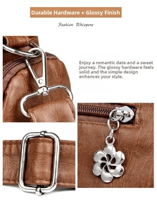 Detail of vintage brown leather bag showing silver metal hooks and floral zipper pull