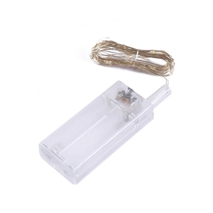 Detail of LED copper wire string lights with a transparent plastic battery case