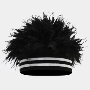 Close-up of black fluffy faux fur beanie with black and white striped elastic band detail