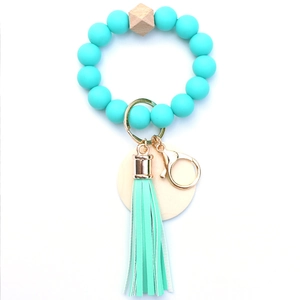 Mint green silicone beaded keychain wristlet with wooden bead and leather tassel