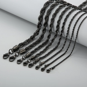Detailed view of various thickness black twisted rope chains with lobster clasp fasteners