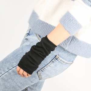 Close-up of black ribbed knit arm warmers with detailed texture and elastic stack effect