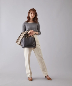 Fashionable black PU leather crossbody bag paired with a modern city commuter outfit