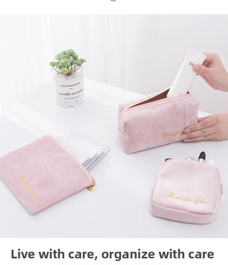 Three-piece set of pink velvet makeup bags with gold beauty embroidery in various sizes