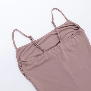 Detail of adjustable straps and side ruched texture on a dusty pink bodycon dress