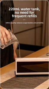 Detail of 220mL water tank capacity with a person refilling the humidifier top