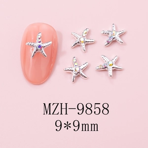 Detail view of 9x9mm silver starfish nail charms with iridescent rhinestones on pink nails