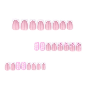 French tip press-on nails with white flowers and heart patterns in pink and white