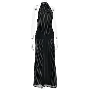 Detail of elegant black and white polka dot halter dress with a stylish waist tie ribbon