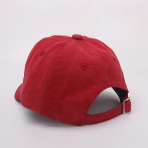 Detailed view of dark red corduroy baseball cap with adjustable metal back buckle