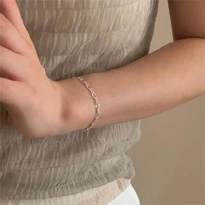 Minimalist S925 sterling silver geometric chain bracelet worn on a female wrist