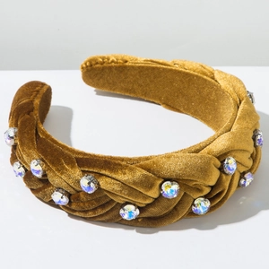 Detailed view of the mustard yellow velvet headband featuring colorful inlaid rhinestones
