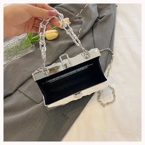 Silver metallic hard shell evening clutch bag with chain strap and black lining