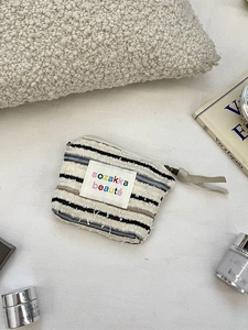 Striped fabric cosmetic bag with sozakka beaute label for daily makeup organization