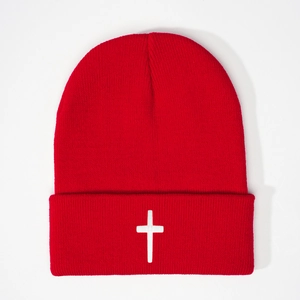 Winter knitted beanie in bright red featuring a white cross embroidery detail