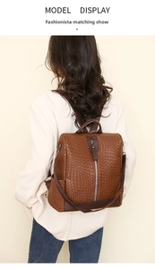 Model view of a brown woven PU leather backpack with vintage design and vertical zipper