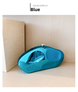 Irregular stone-shaped evening clutch in metallic blue with gold clasp detail