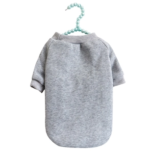 Close-up of grey knit dog sweater on a pearl hanger with ribbed neckline details