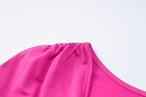 Detail of ruched V-neckline on a rose pink slim fit long sleeve autumn dress